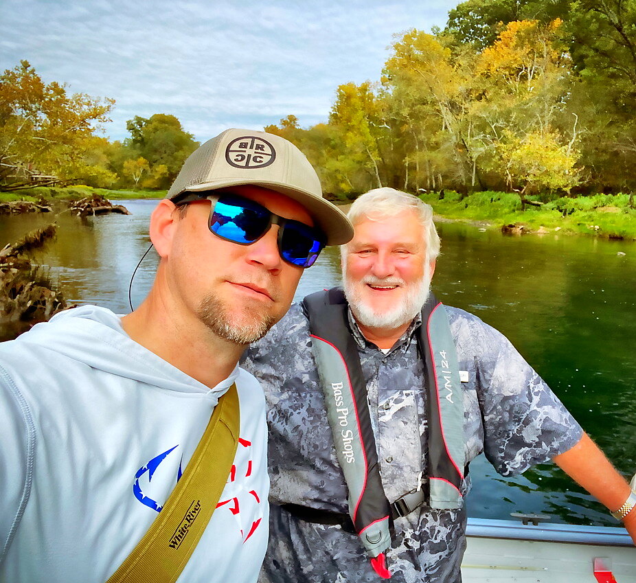 Fly fishing guide with a client on an Ozark tailwater