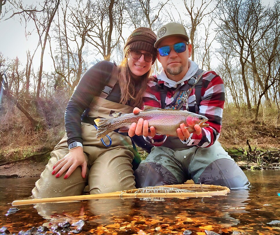 Angler with a brown trout on the Little Red River
